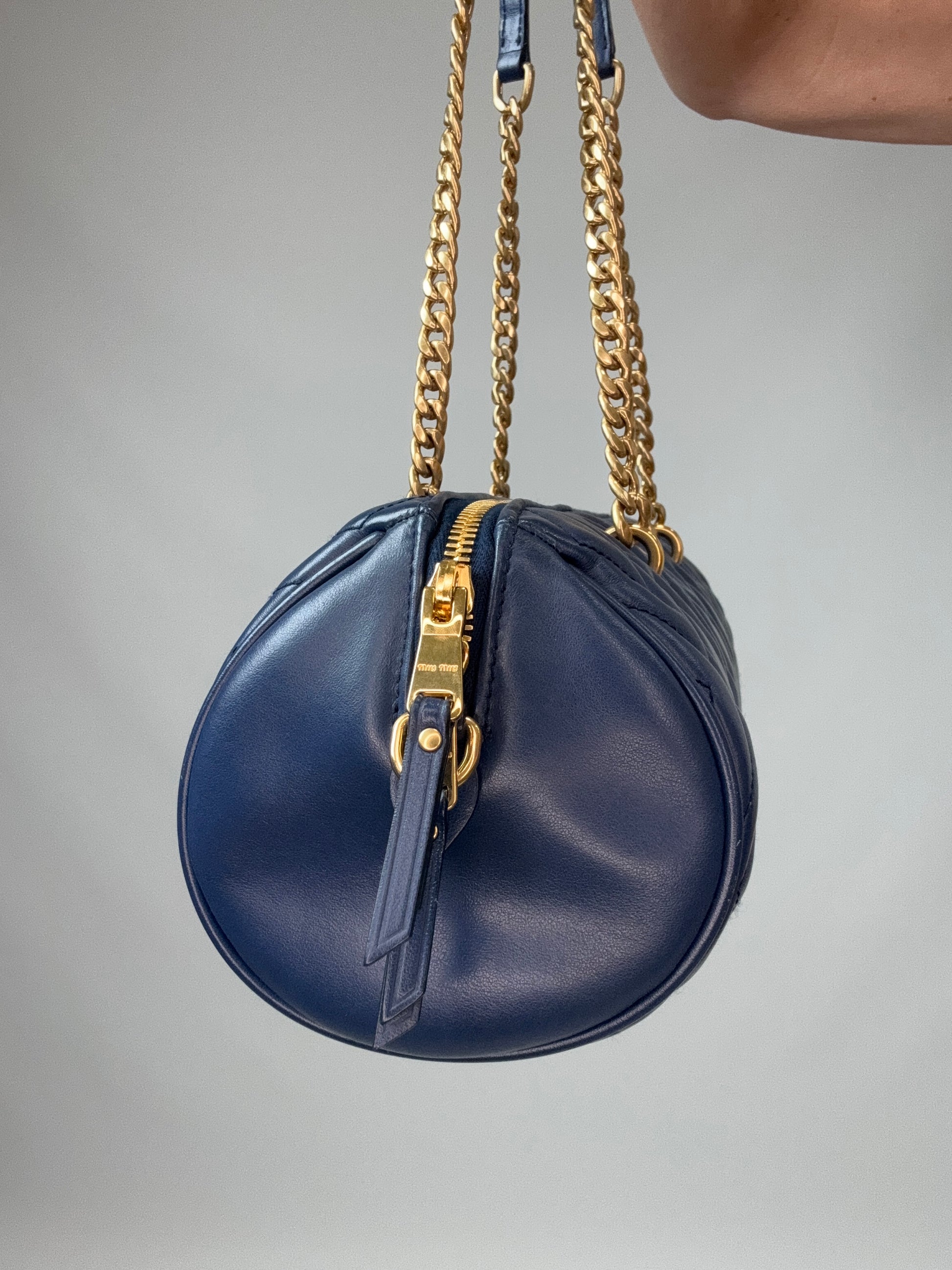 Miu Miu Diamond Quilted Cylinder Bag in Blue left side