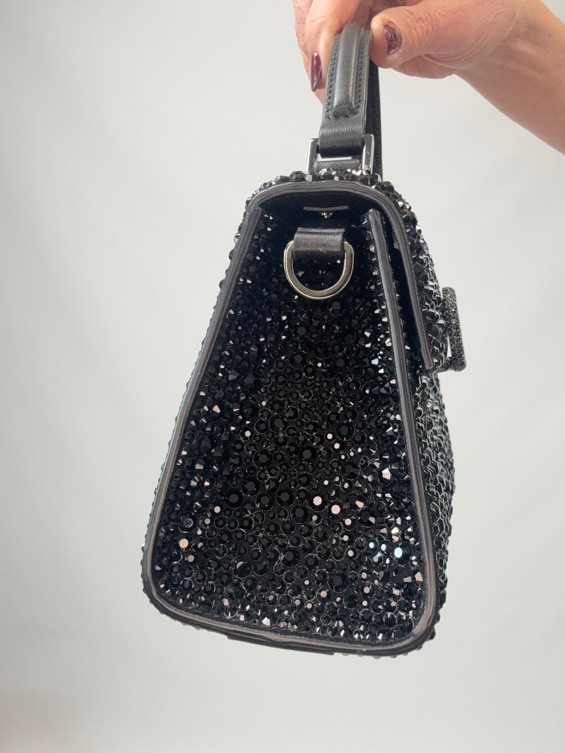 Valentino Garavani Mini VSling - Black left side of handbag