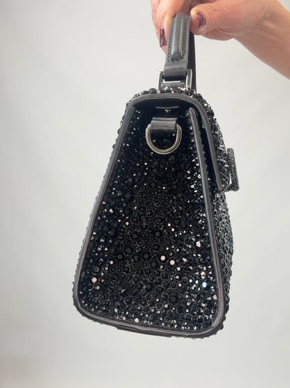 Valentino Garavani Mini VSling - Black left side of handbag